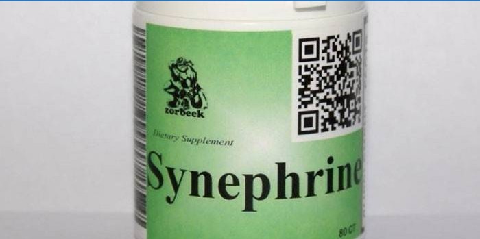 Synefrin tablety ve sklenici