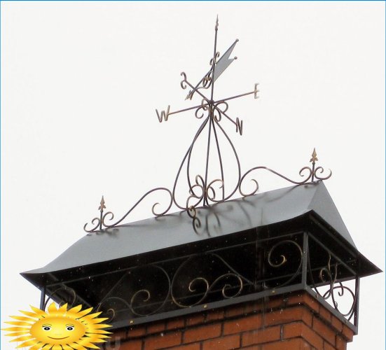 Větrná korouhvička na střeše domu