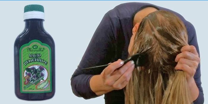 Žena na její vlasy položí lopuchový olej